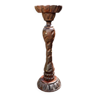 Old ashtray on carved wooden stand