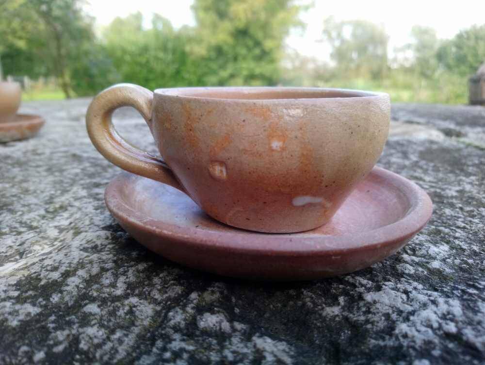 6 stoneware coffee cups and saucers