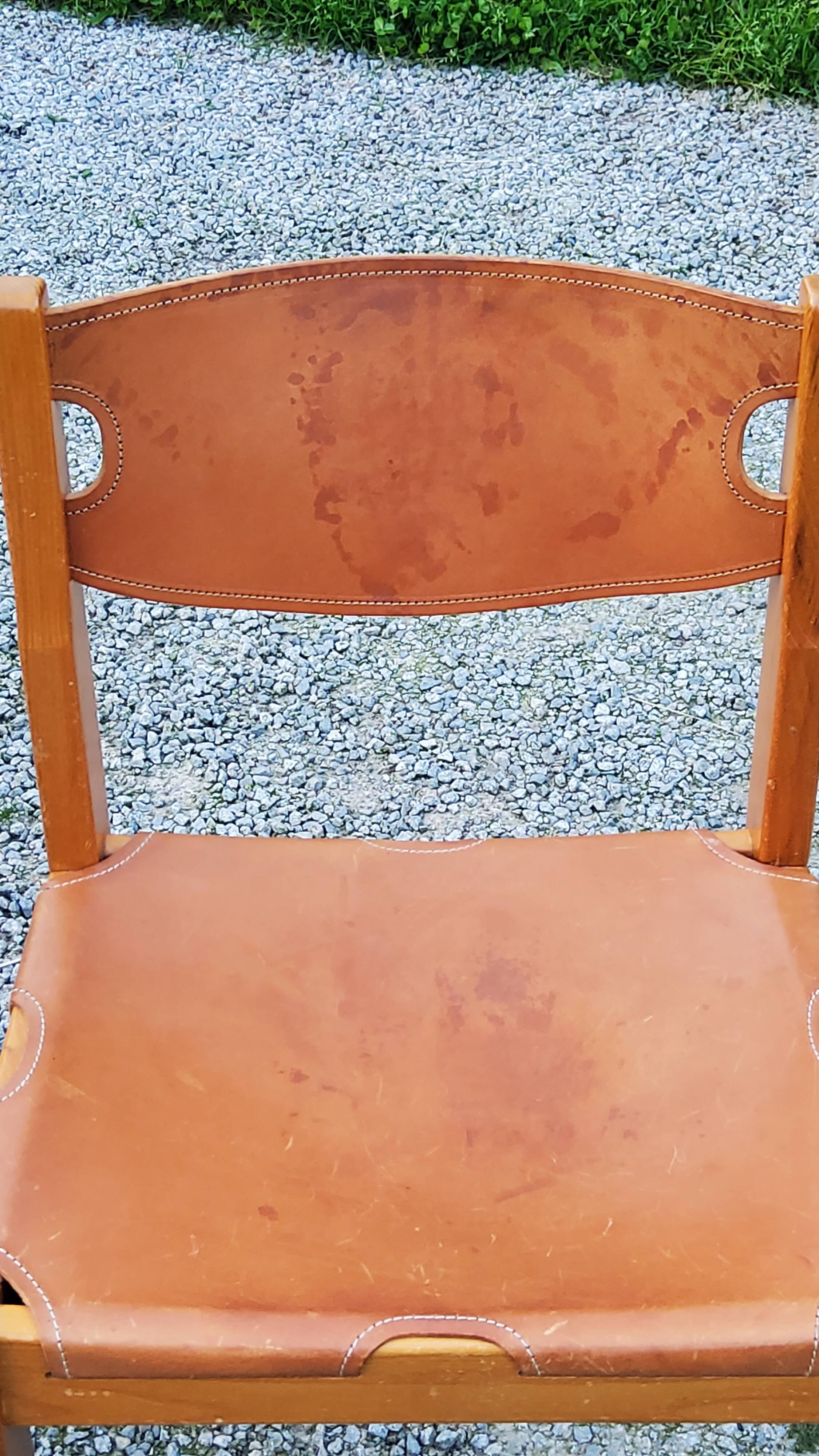 Pair of brutalist chairs in elm and stretched leather with saddle stitching Self publisher