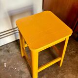 Yellow wooden stool