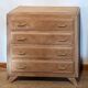 Vintage oak commode with tapered legs.