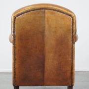 Stately, sleekly finished, comfortable sheepskin armchair