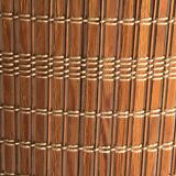 Mid-Century brown wooden and metal floor lamp, large diameter woven lampshade from the 1950s.