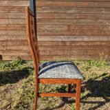 Set of 8 teak lounge chairs with high backs and zebra-striped seats