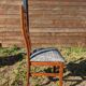 Set of 8 teak lounge chairs with high backs and zebra-striped seats