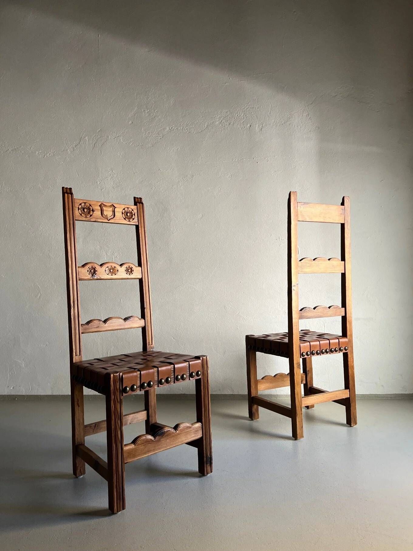 2 brutalist carved wood dining chairs with leather seat | The Netherlands | 1970s