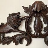 Antique carved wooden pediment with lions and medallion