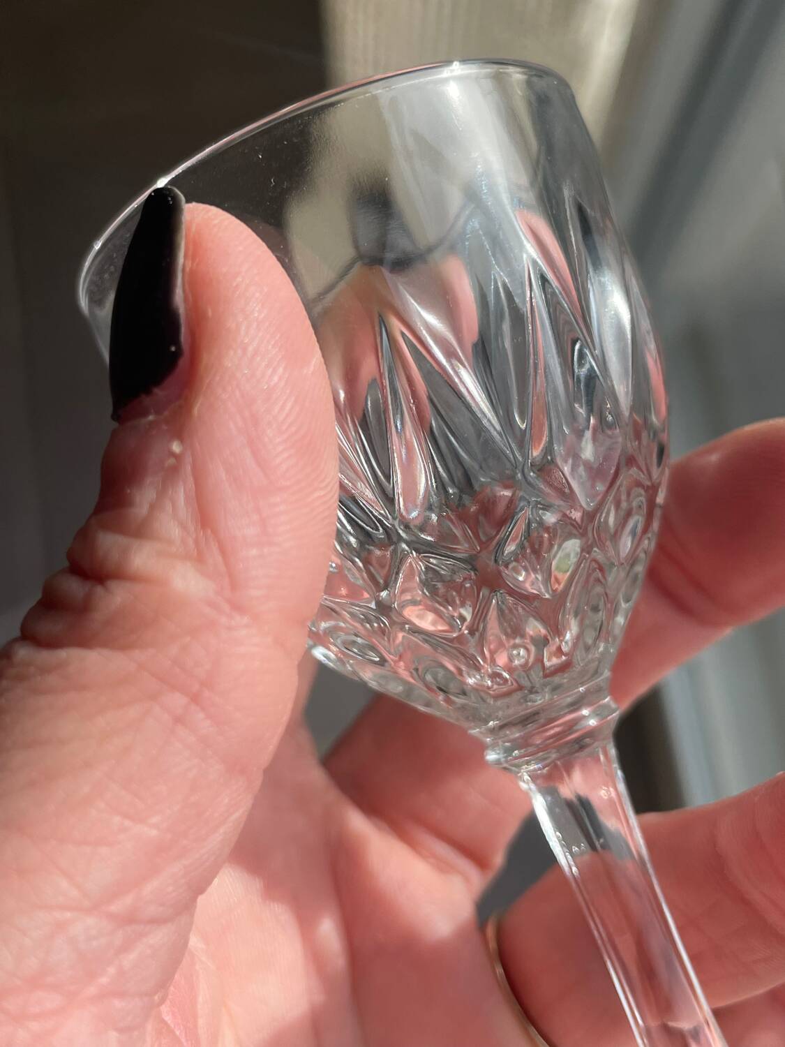 4 cut glass liqueur glasses on stems