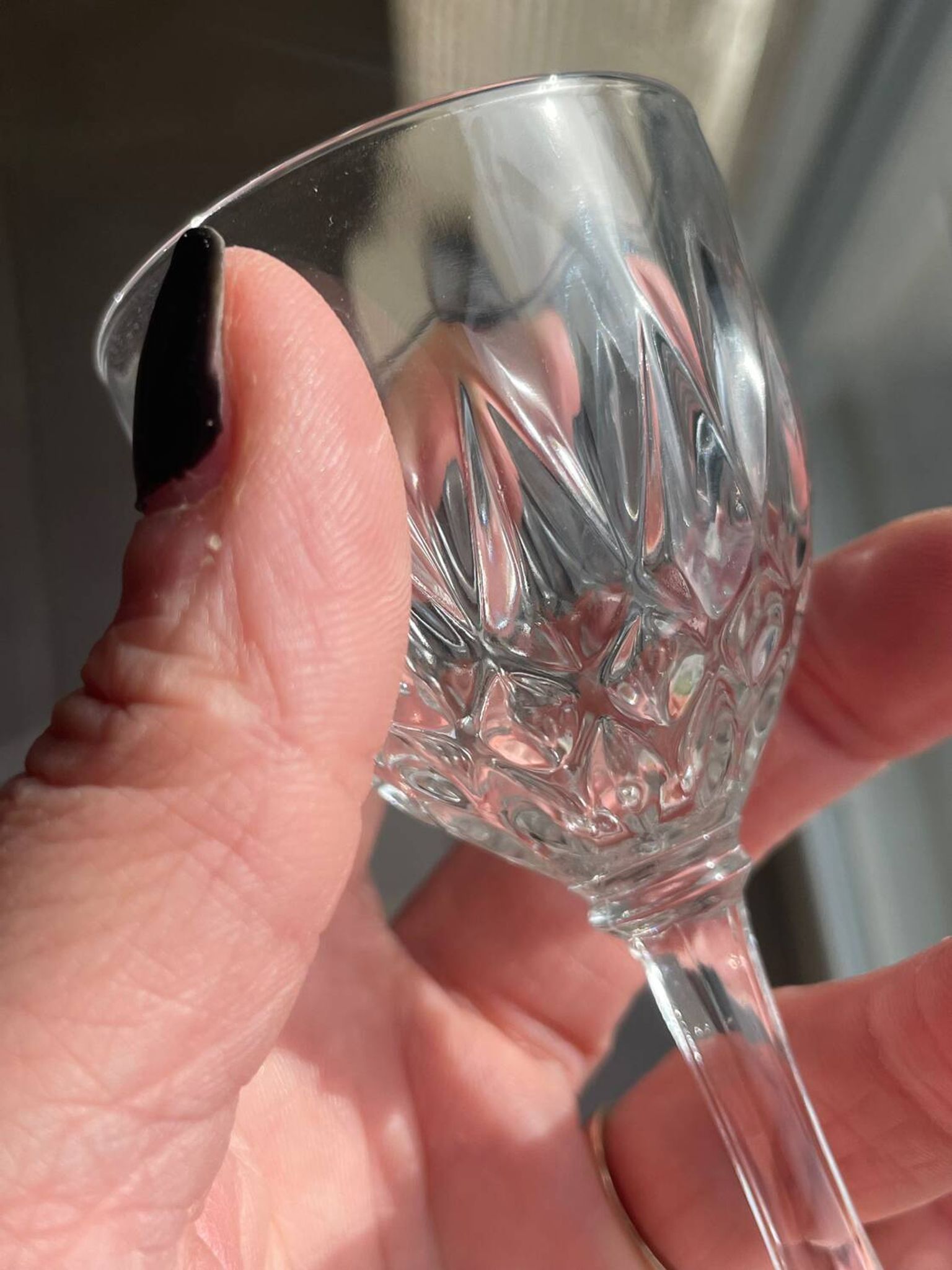 4 cut glass liqueur glasses on stems
