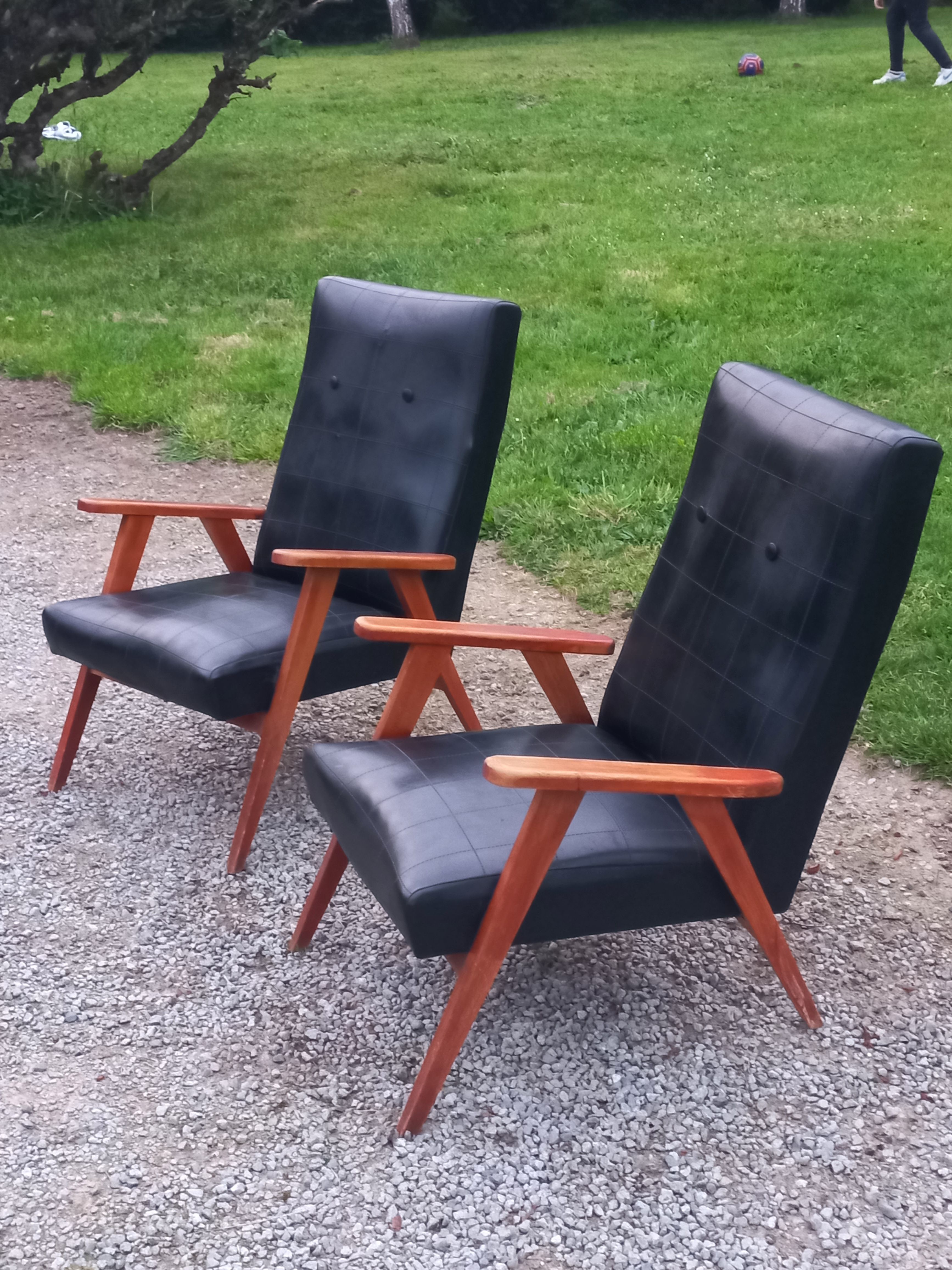 Pair of vintage beech armchairs feet compass covered with black moleskine from the 50s