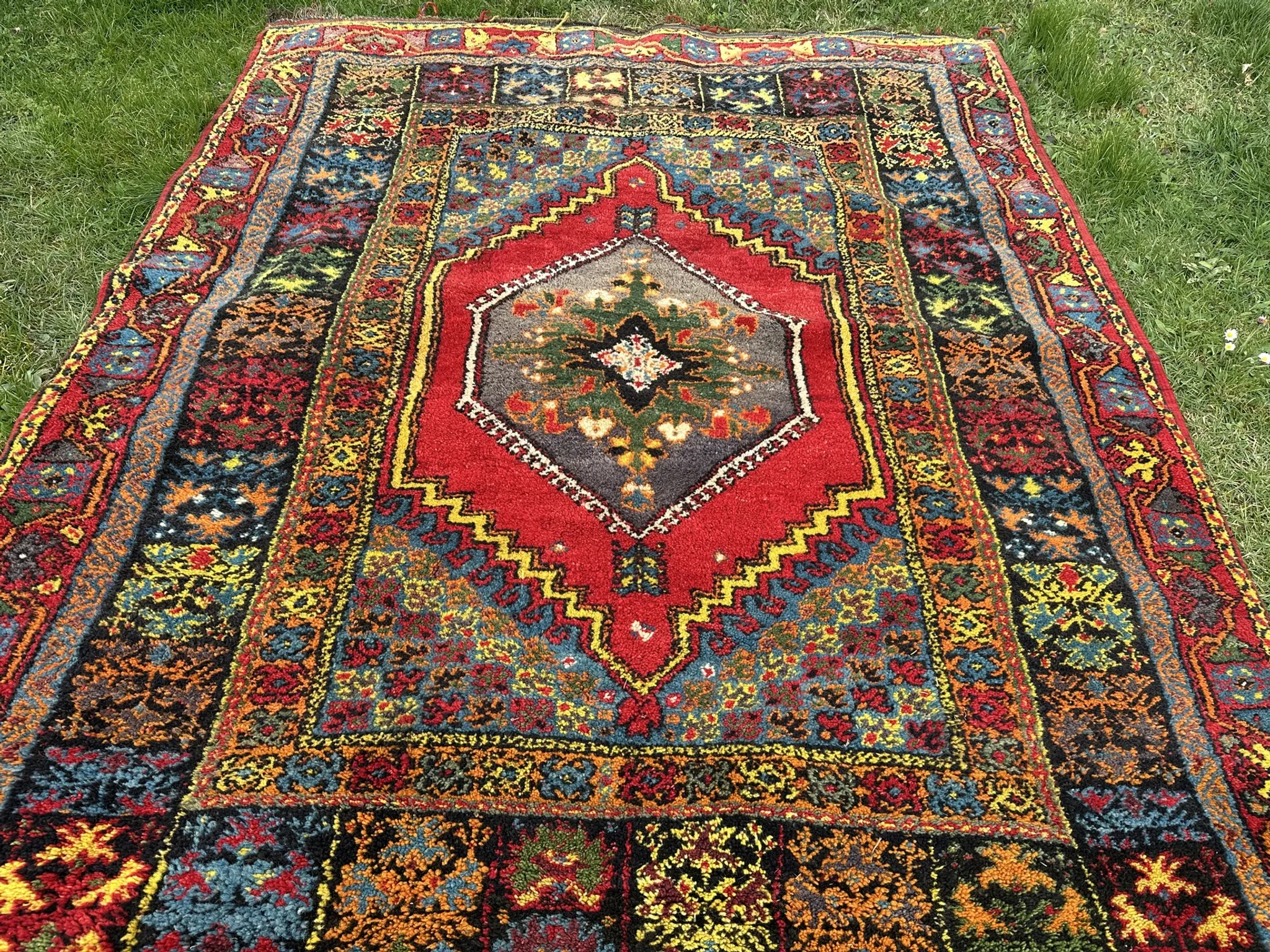 Old Moroccan carpet, made of natural wool and handwoven.