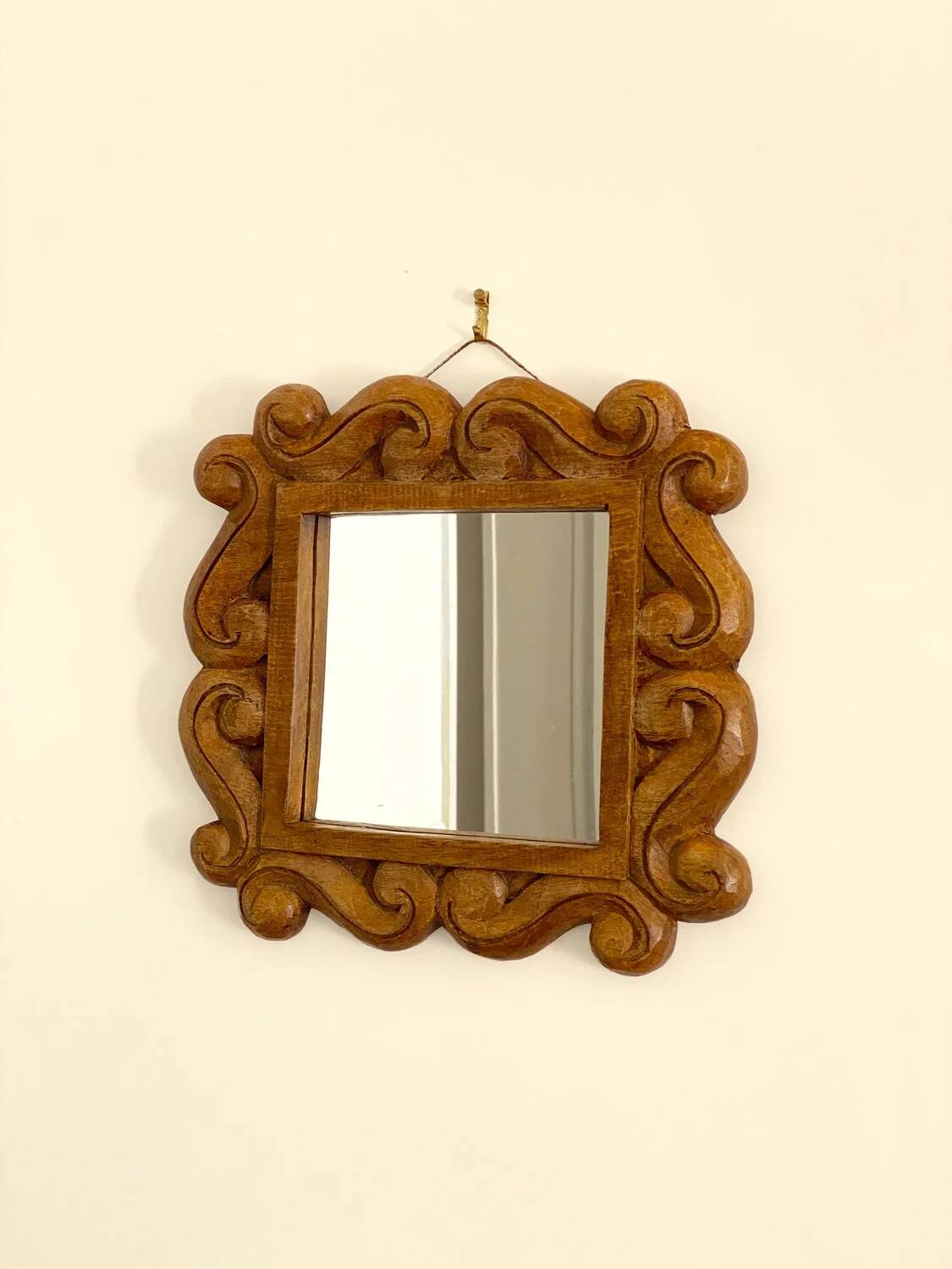 Carved wooden mirror