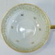 Green and gilded LIMOGES porcelain cup and cup lunch