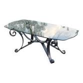 Table basse des années 70 en fer forgé plateau en verre bec de corbin
