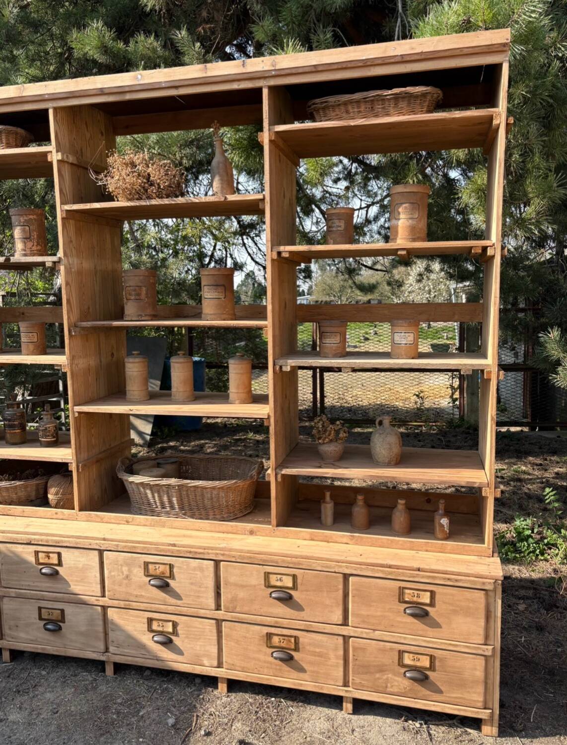 Large antique workshop furniture with drawers and shelves.