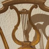 Pair of chairs with a golden lyre