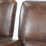 Set of two characterful sheepskin armchairs with a beautiful deep colour