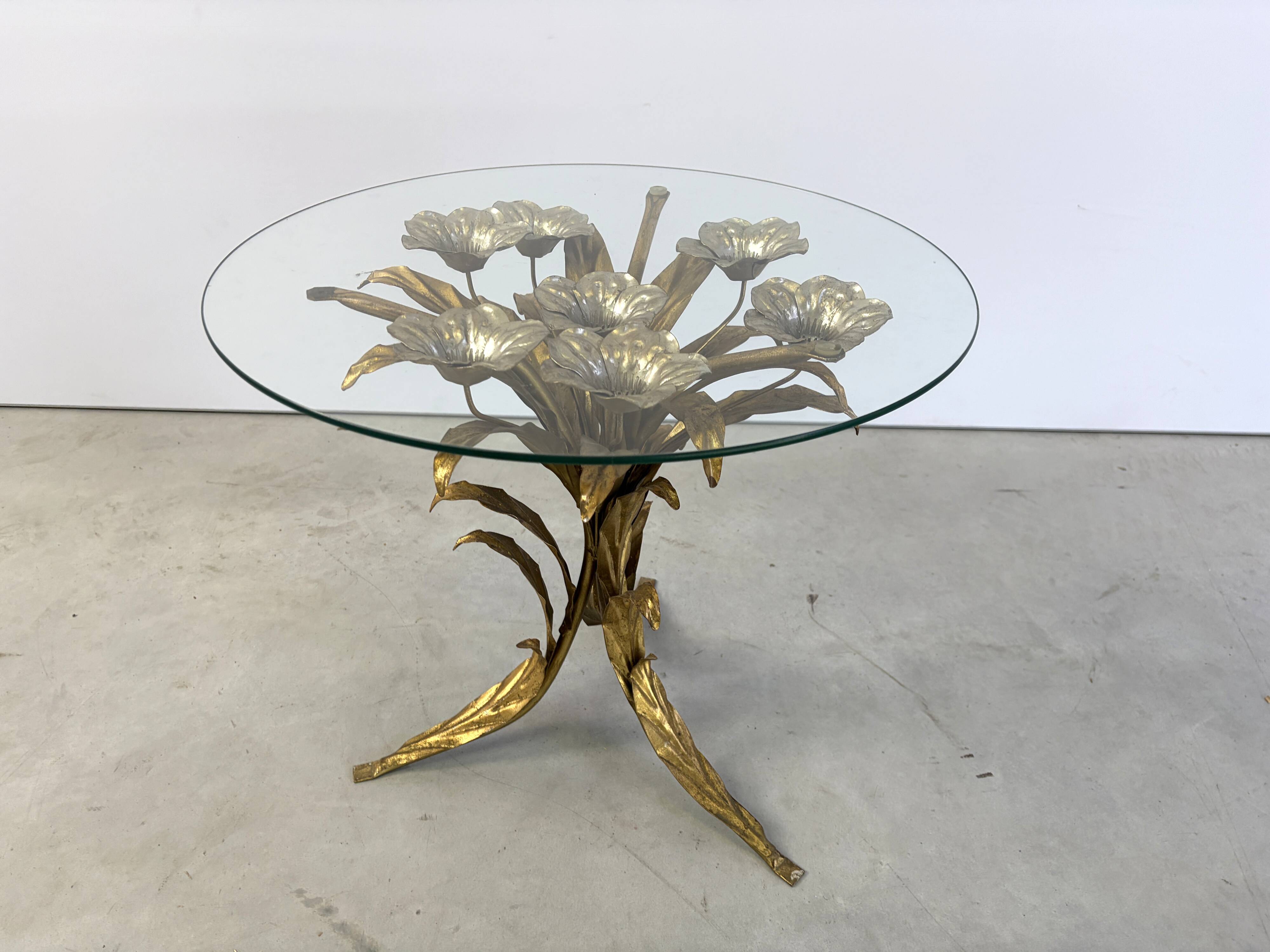 Charming metal flower coffee table or side table with a clear glass top. Made in Italy, attributed to Hans Kögl.