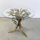 Charming metal flower coffee table or side table with a clear glass top. Made in Italy, attributed to Hans Kögl.
