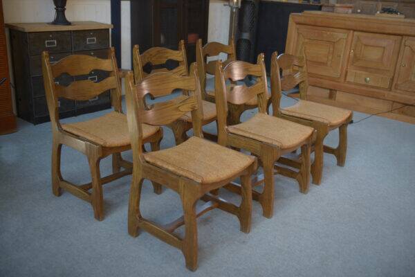 Set of 6 oak dining chairs with rush seat and 'Echelle' backrest in the style of Guillerme et Chambron 1950s