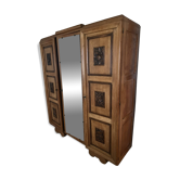 Art Deco wooden wardrobe with floral sculptures and mouldings.