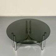 Round coffee table in smoked glass and chrome steel, 1970s design.