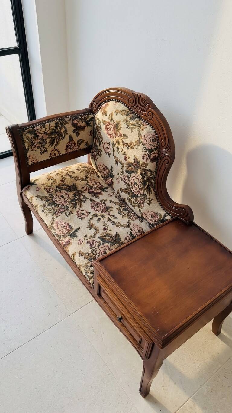 Antique wooden telephone bench in dark brown.