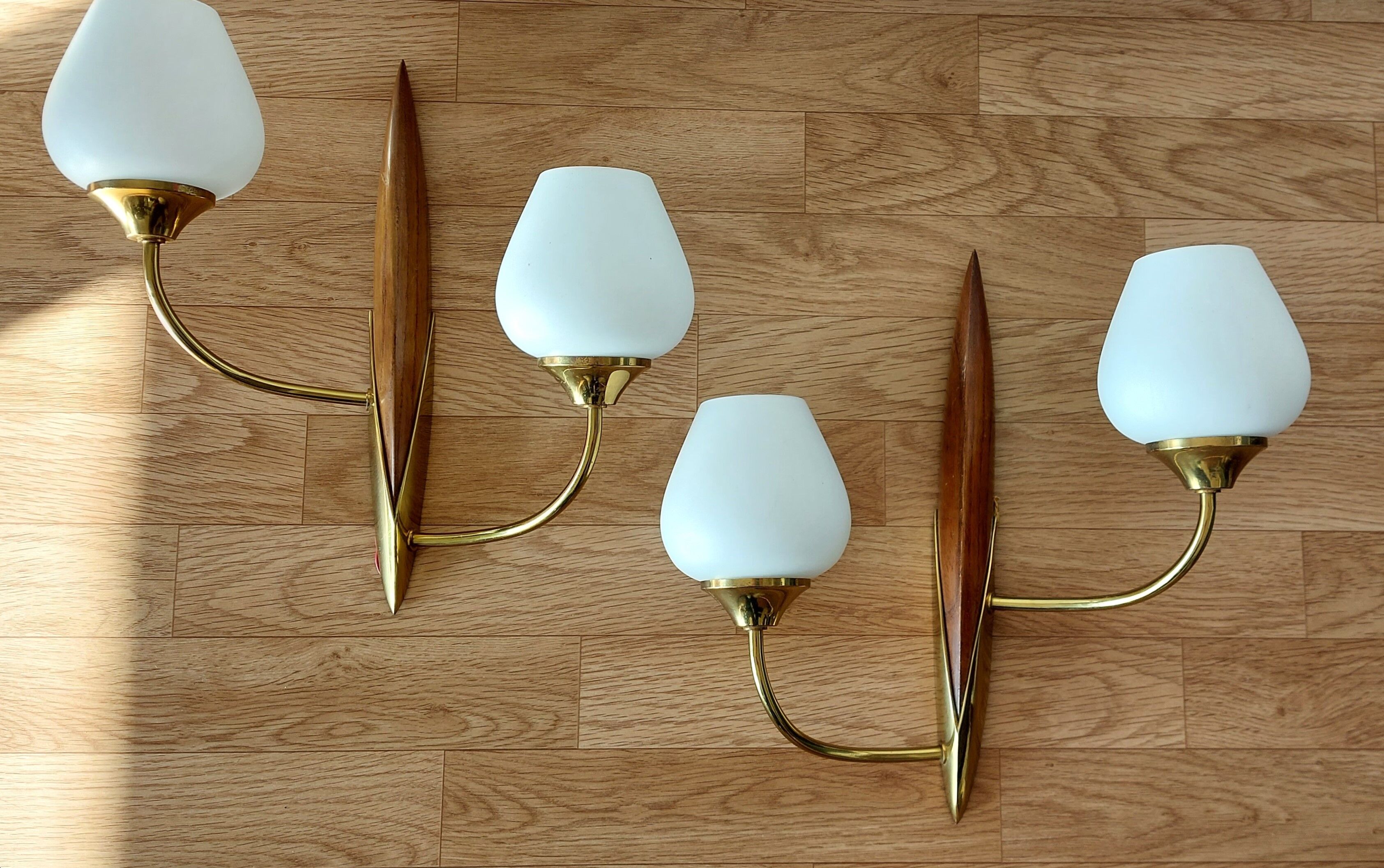 Pair of wood and gilded brass sconces 1950 boat hulls with 2 lights.