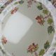 Short antique Longchamp stand with polychrome daisies in earthenware.