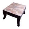 Wooden selette footrest supporting plants