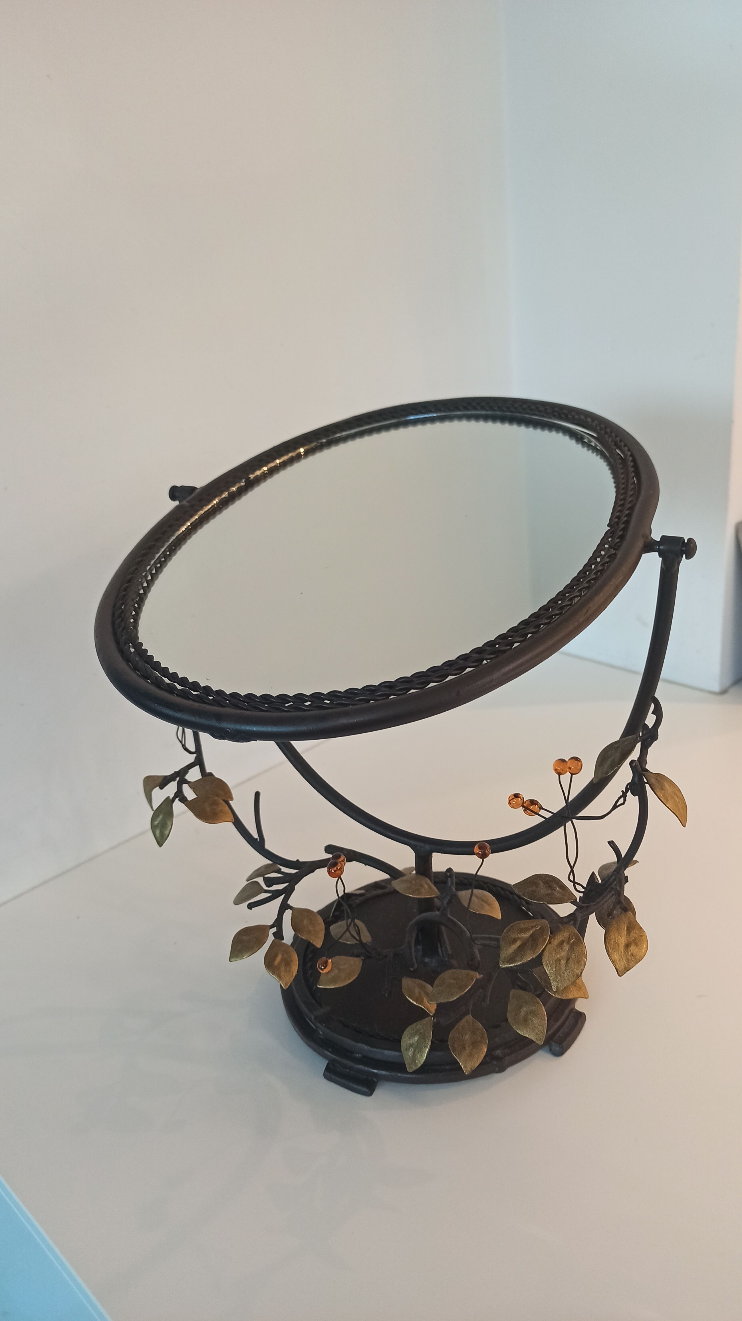 Table mirror, tilting psyche in patinated bronze decorated with leaves and fruits