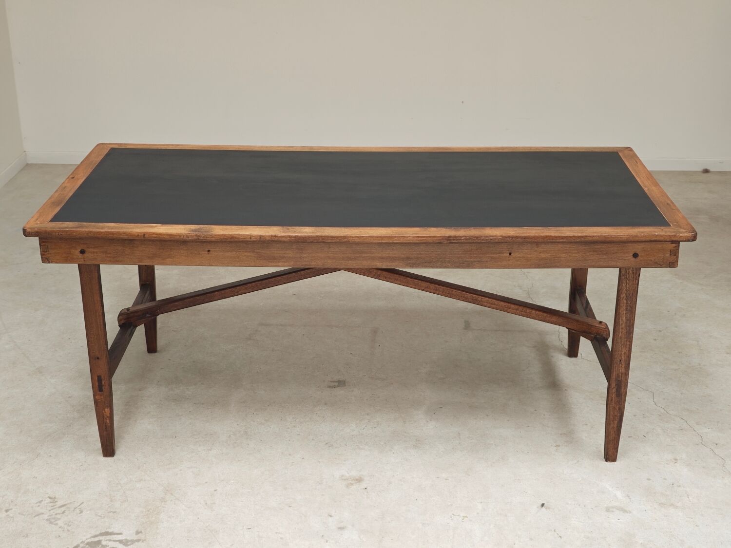 Vintage workshop folding table in oak with a hand-patinated black top.
