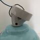 Wall light in ceramic with a light blue glass globe.