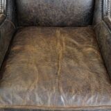 Set of 2 black cow leather armchairs finished with decorative nails, industrial style
