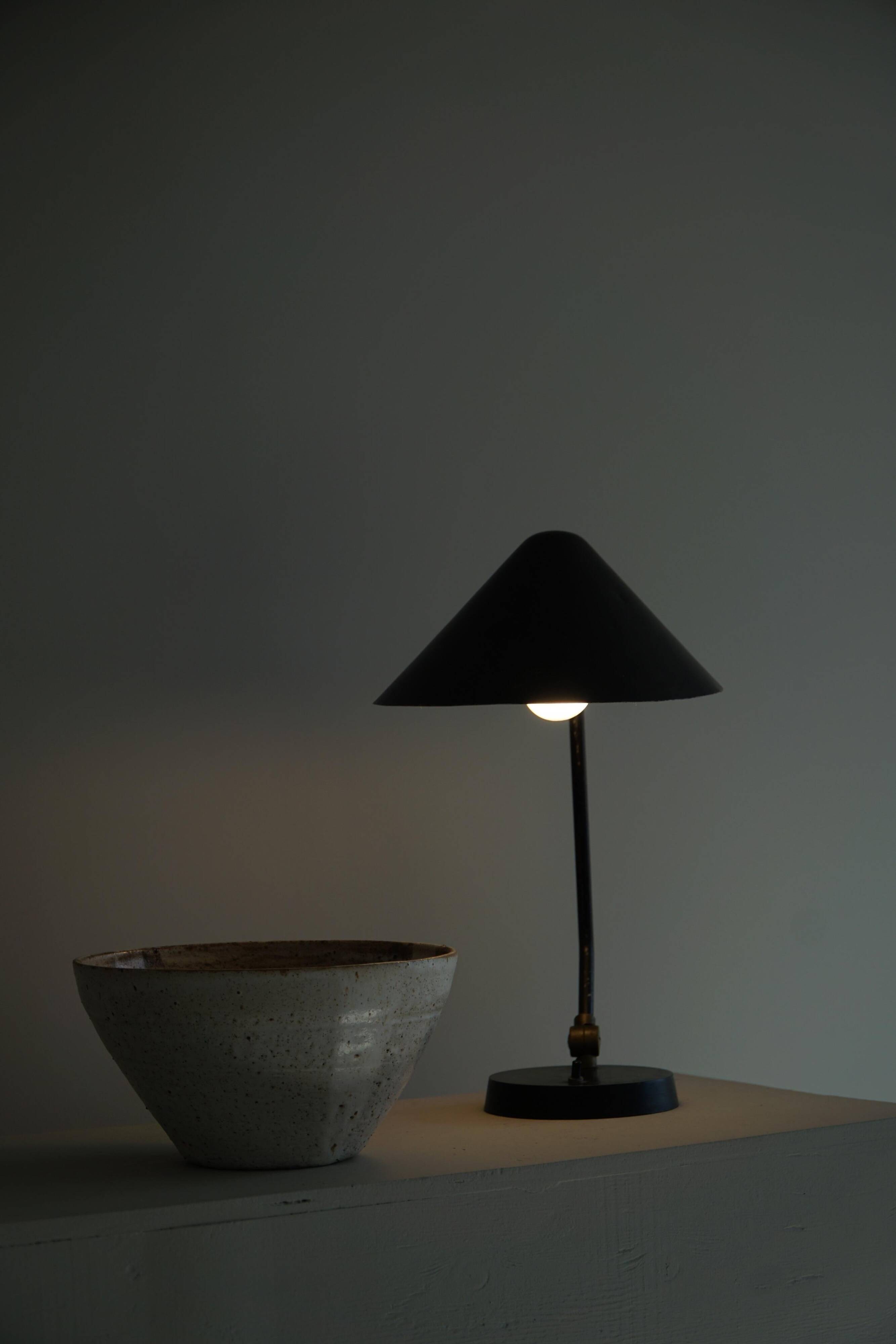 Modern adjustable Danish table lamp in metal, made by Louis Poulsen, 1950s.