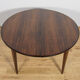 Table à manger ronde en palissandre de style mid-century moderne modèle 55 par Gunni Omann pour Omann Jun, Danemark, années 1960.