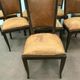 Suite of 8 seated tinted wooden chairs and tawny leather backrest 1970s