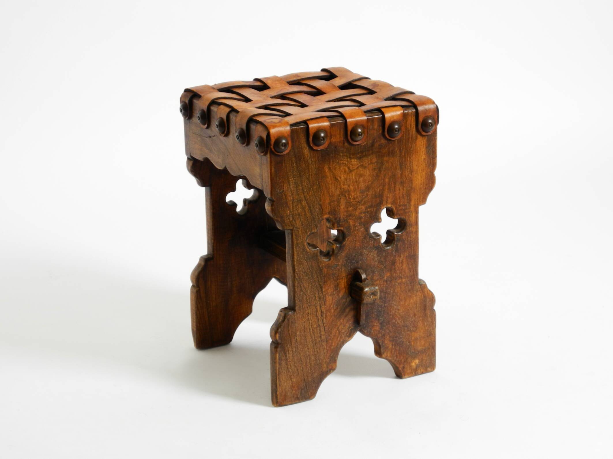 Beautiful 1940s oak stool with a seat made of leather straps