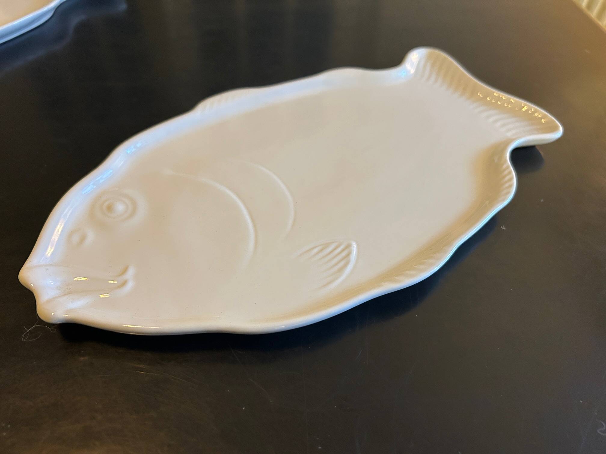 two Revol fish dishes