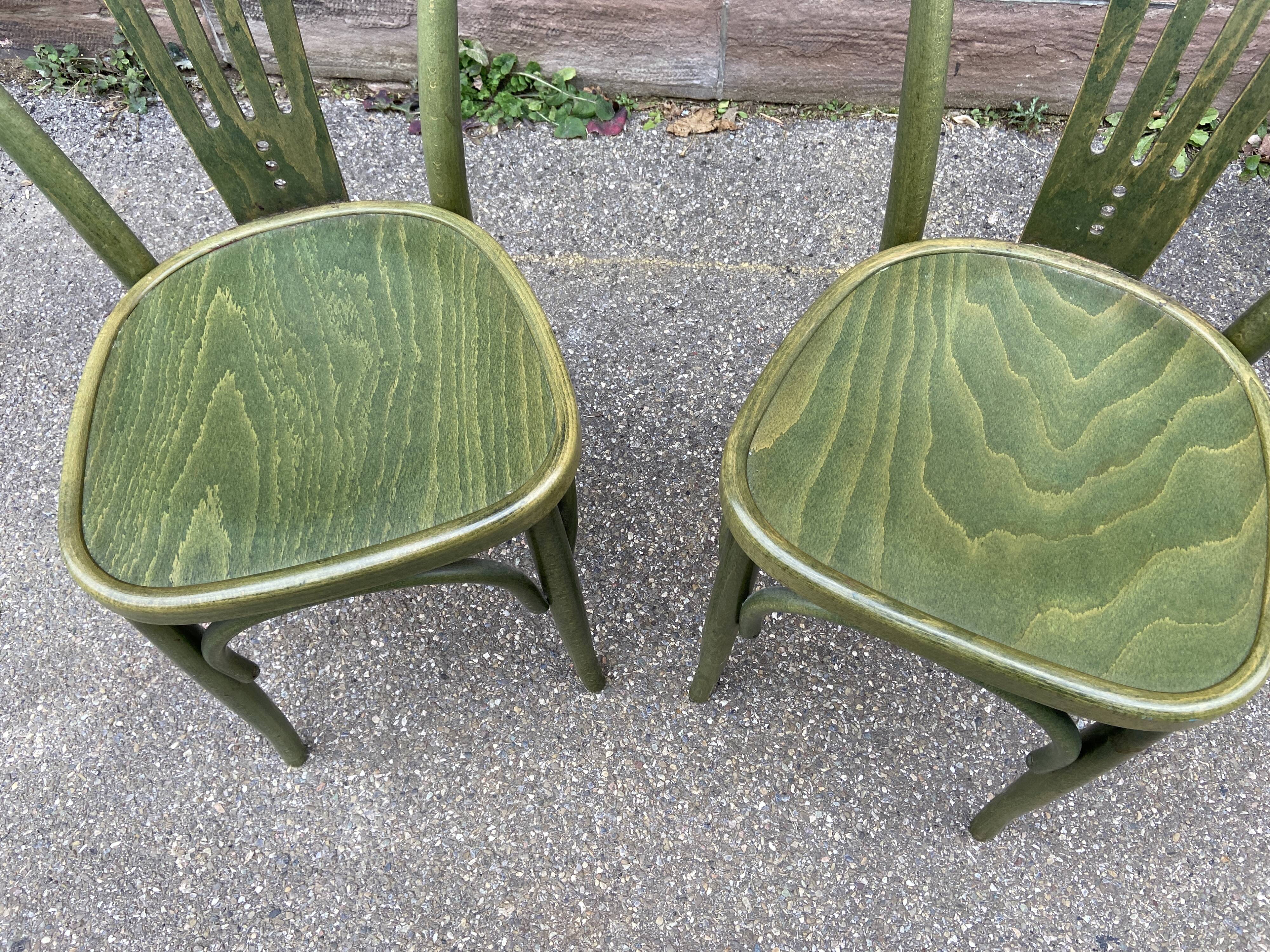 2 curved wooden bistro chairs