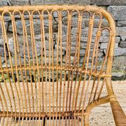 Fauteuil en rotin et piétement en métal noir 1960
