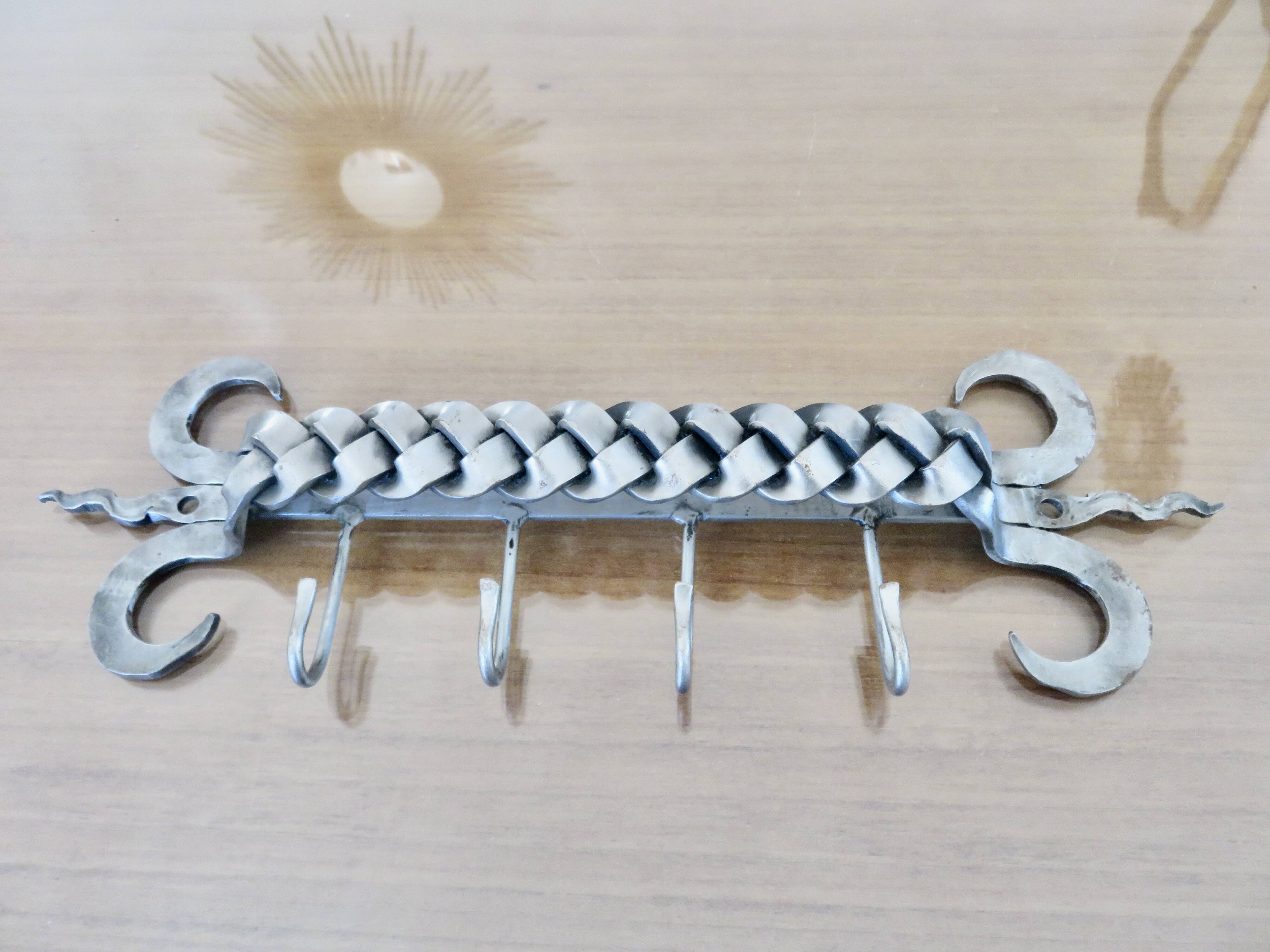 2 Tea towel holders, ironwork in braided raw steel, 1970