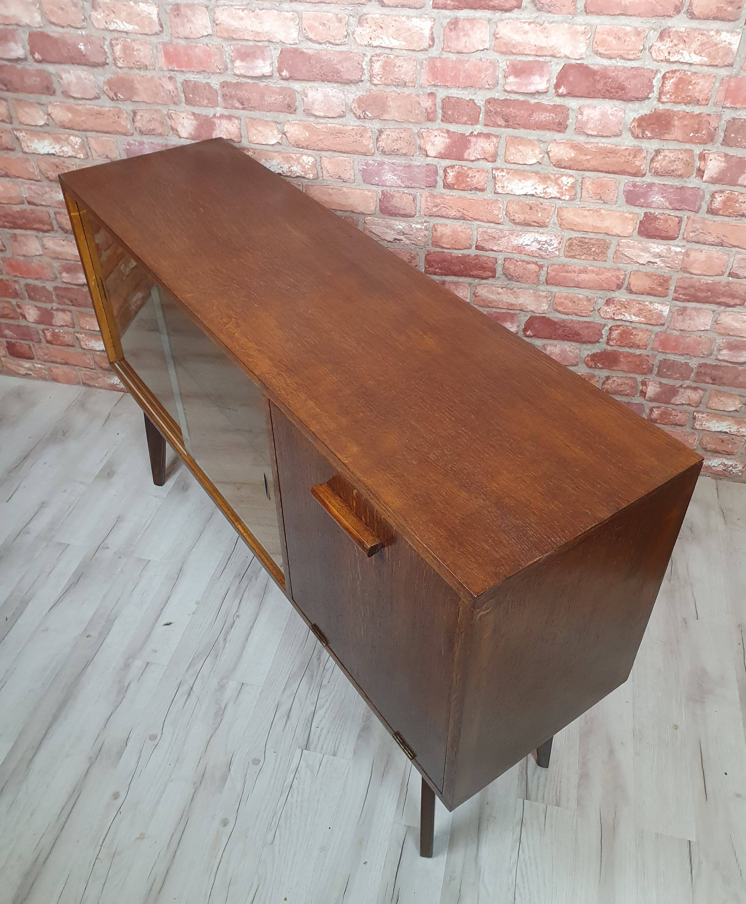 Renovated oak display cabinet with a bar on slanted legs