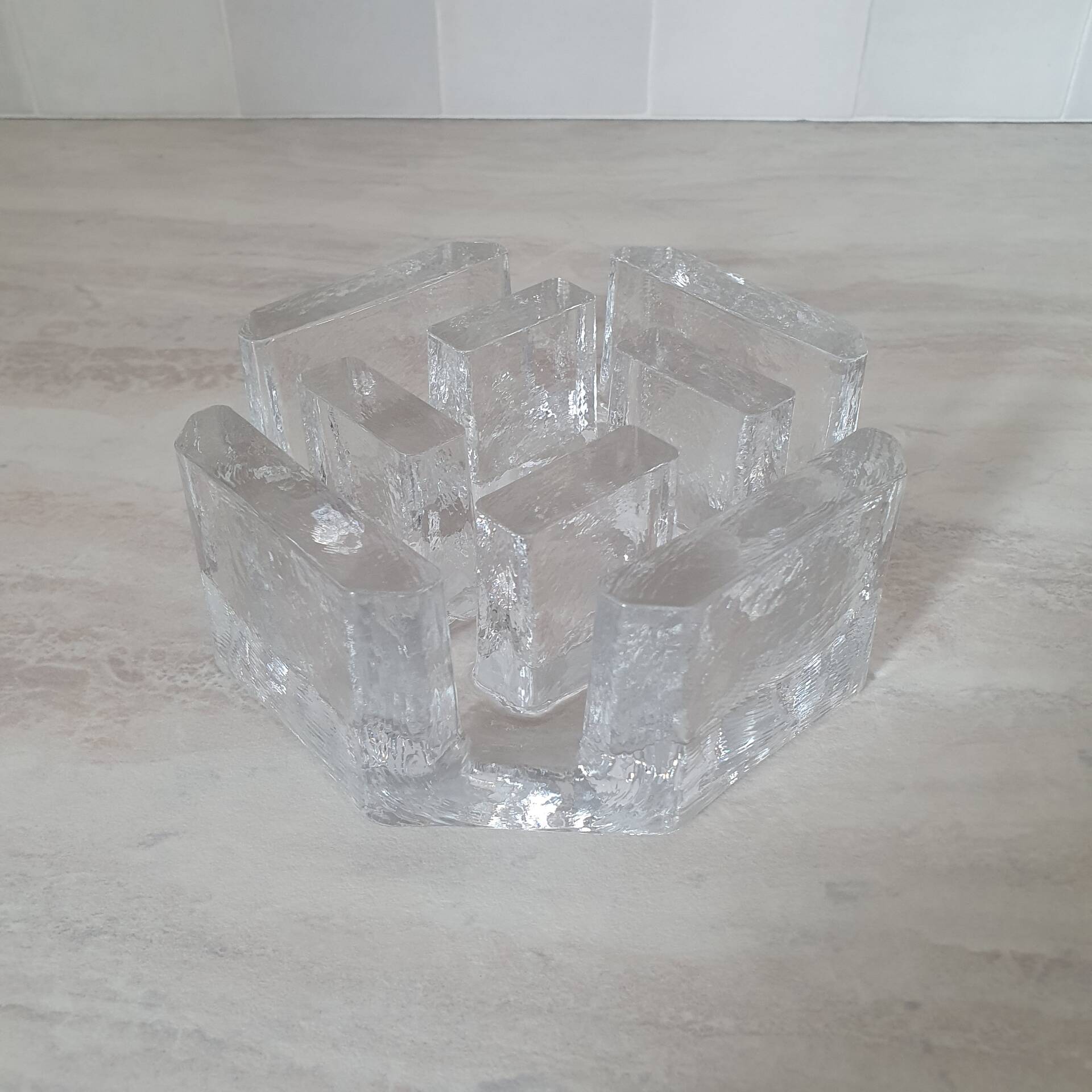Candle holder or glass warmer with irregular ice effect.