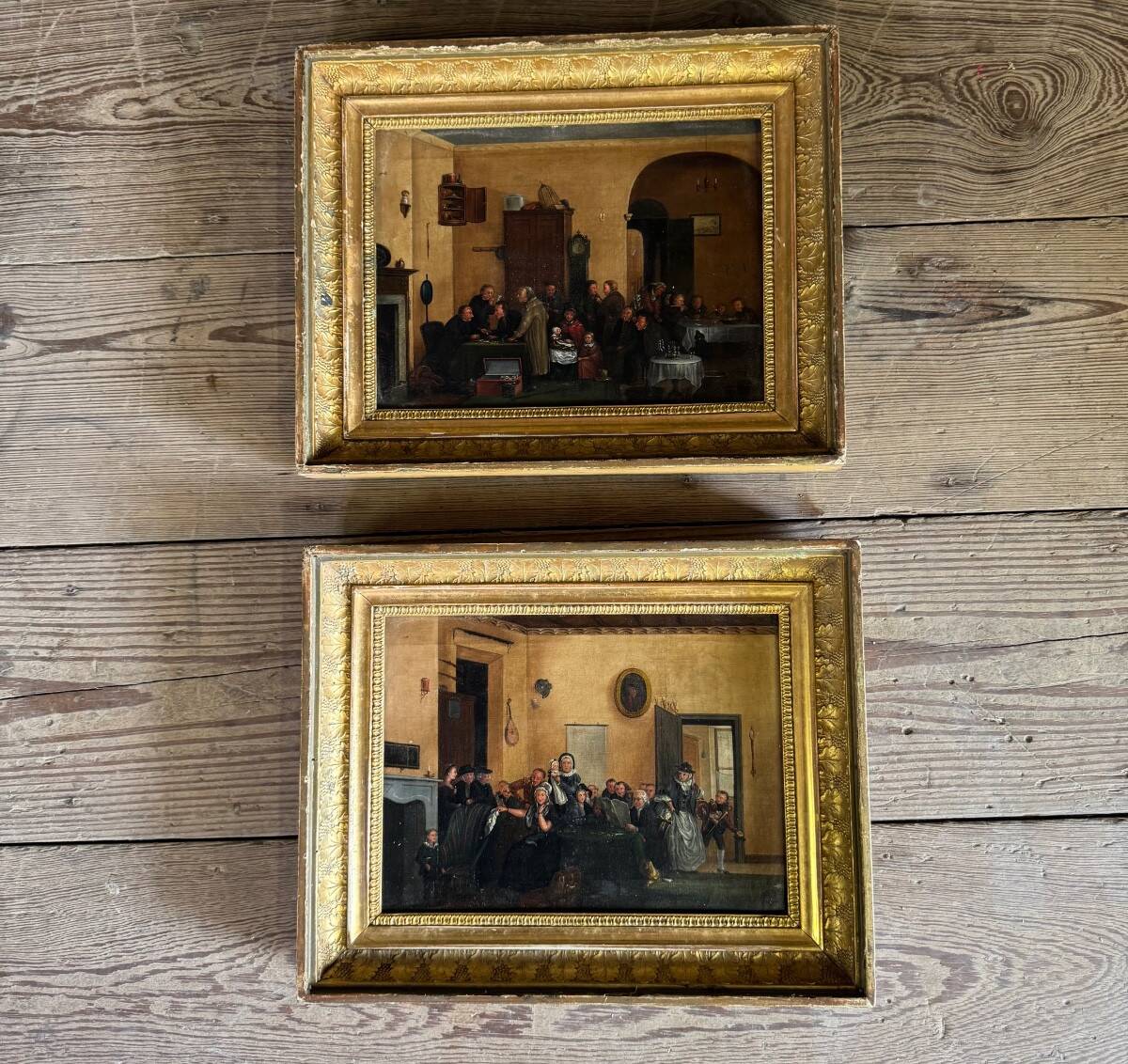 Pair of paintings, animated family scenes, oils on canvas, early 19th century