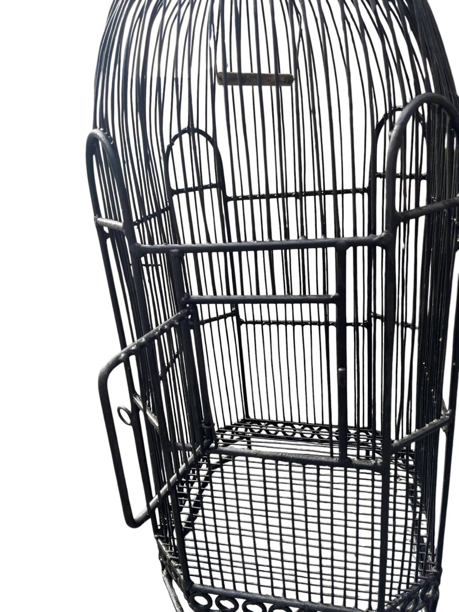 Old black metal birdcage from the early 20th century.