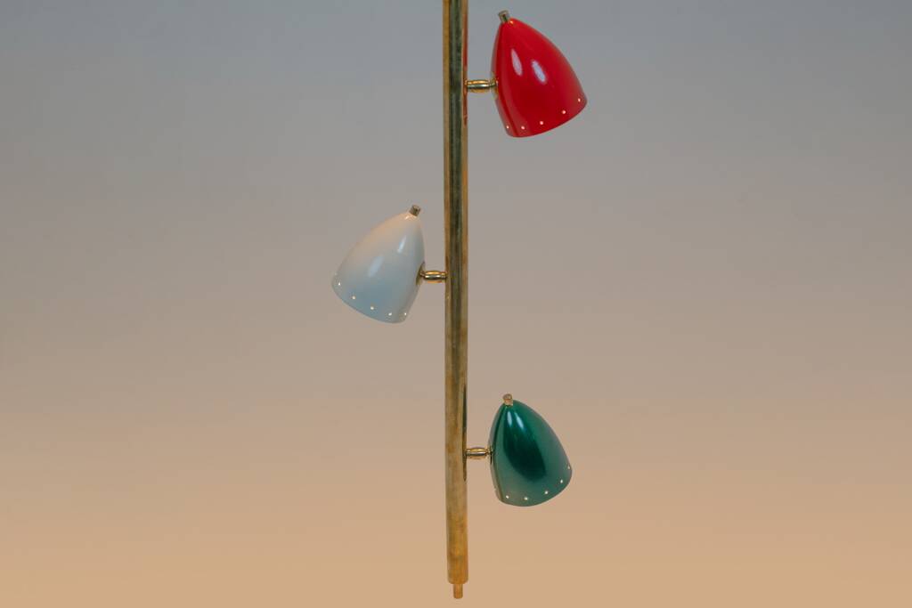 Tubular pendant light in patinated and lacquered brass. Contemporary