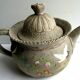 Japanese Art Deco teapot in porcelain biscuit enamelled with cranes and flowers