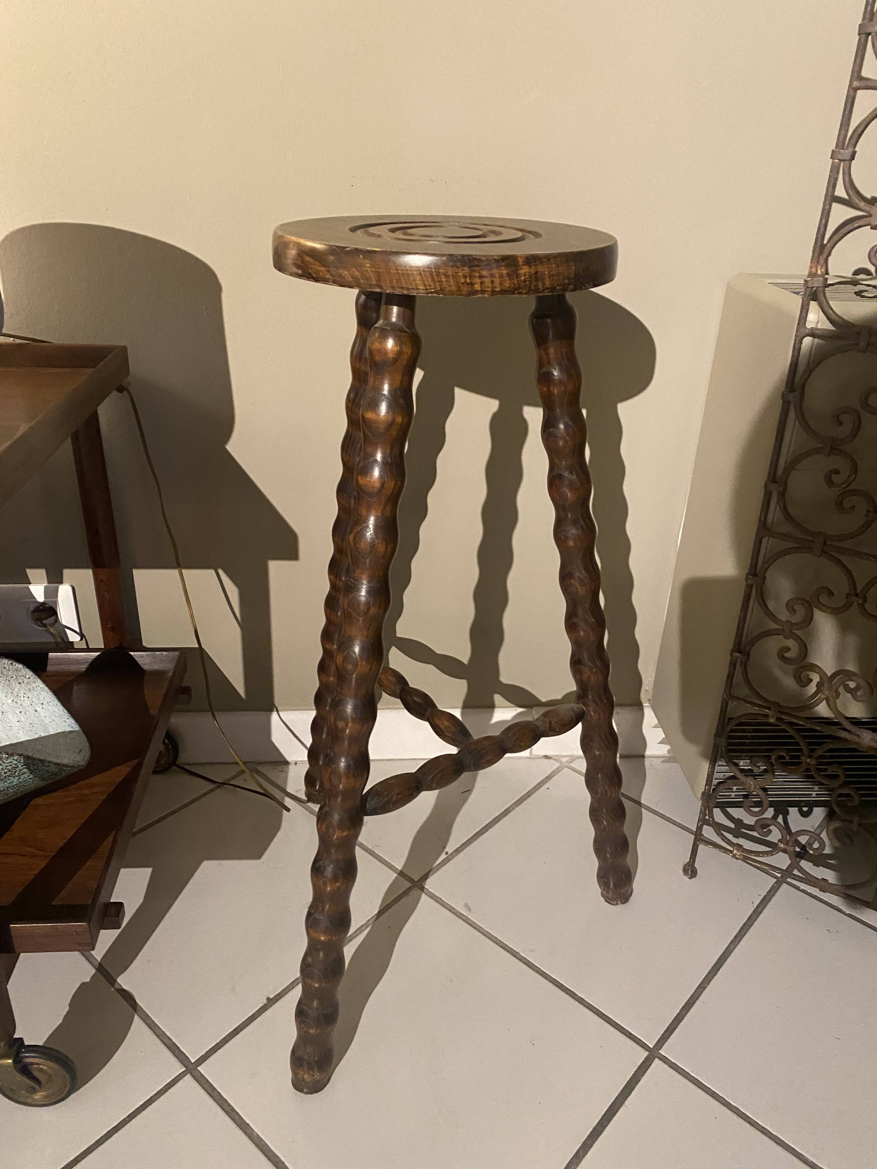 High carved wooden stool