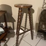 High carved wooden stool